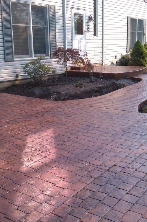 Stamped concrete walkway and driveway by Dugan Concrete
